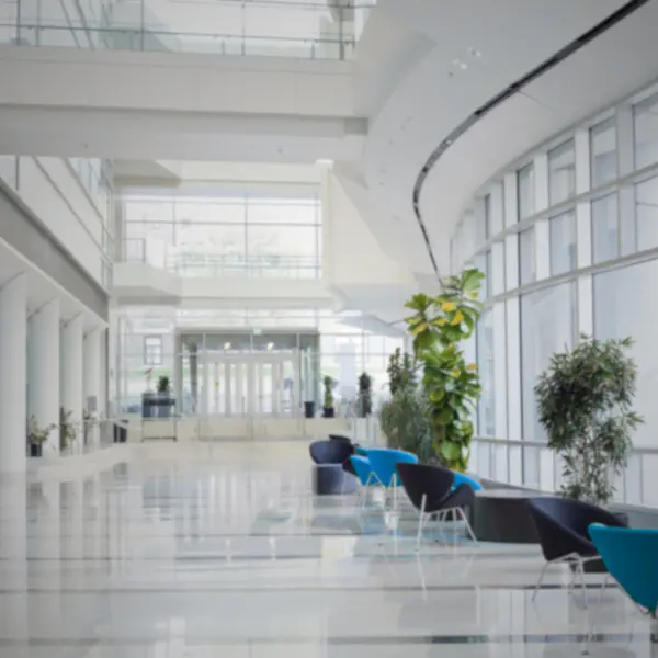 Modern commercial building interior with seating and glass architecture